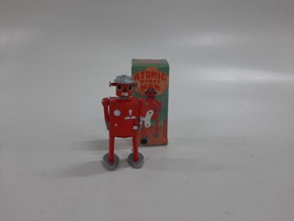 Robot rojo y plata de cuerda